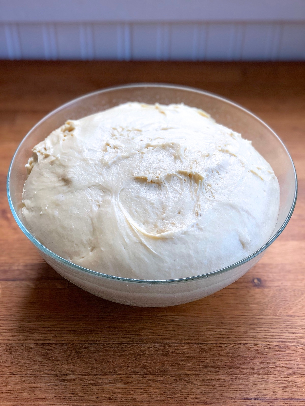 Dough for Amish Dinner rolls in a bowl, nicely risen after 2 hours.