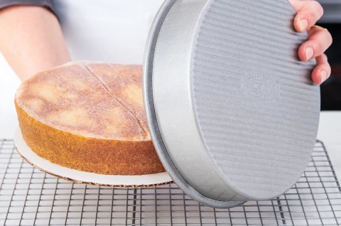 Cake being depanned.