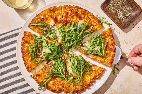 A Giant Cheesy Corn Fritter that has been sliced into pieces - select to zoom