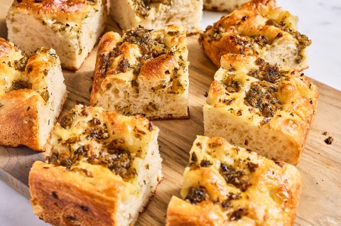 Side view of stuffing focaccia showing the integrated ingredients and rise of the bake. - select to zoom