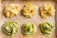 Sourdough Pasta nests on a sheet of parchment