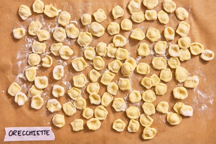 Orecchiette pasta shape on a parchment-line baking sheet