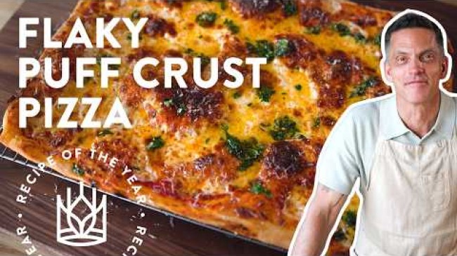 Click to open a video entitled Flaky Puff Crust Pizza Recipe Walkthrough
